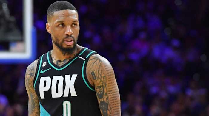 Trail Blazers point guard Damian Lillard looks on during a game.